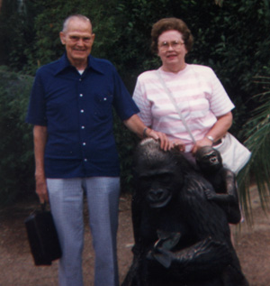 Posing with a bronze gorilla statue